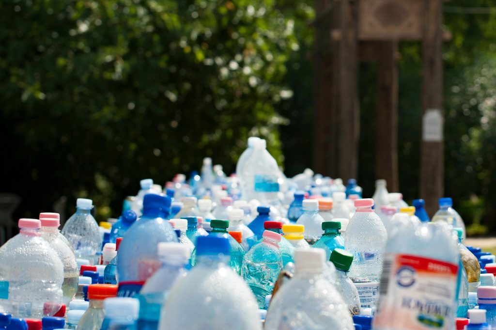 A large collection of plastic bottles ready for recycling, promoting sustainability and waste management.